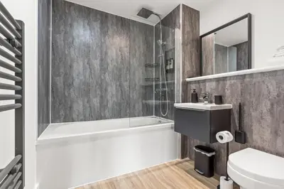 a bathroom with a tub and a toilet and a sink at Ideal for Getaways Liverpool Flat, sleeps 4 in Liverpool