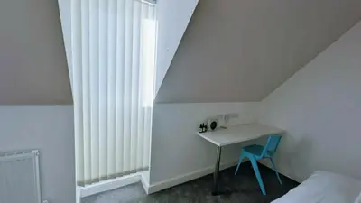 a bedroom with a desk and a bed and a window at Stylish 3BDR New Build Home In Everton Park in Liverpool