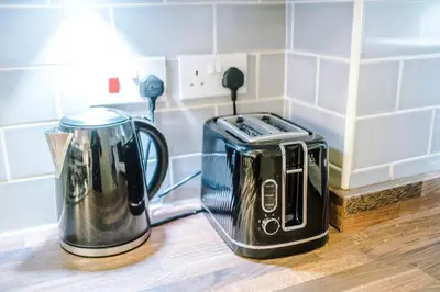 a toaster and coffee maker sitting on a counter at Spacious 3 bedroom home with garden in Heapey