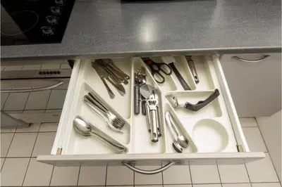 a kitchen drawer filled with utensils and a sink at Central Albert Dock 2Bed 2Bath in Liverpool