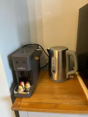 a coffee maker sitting on top of a counter at Victoria suites in Southport