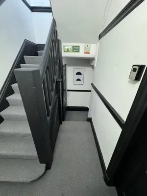 a staircase in an office building with a stair case at The residency appartment's in Litherland