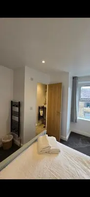 a bedroom with a bed with a pillow on it at Cozy Stays Lancaster in Lancaster
