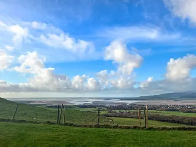 a view of a field with a blue sky and clouds at Hardknot - Uk48484 in Dalton in Furness