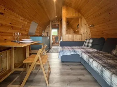 a room with a couch and a table in a cabin at Hardknot - Uk48484 in Dalton in Furness