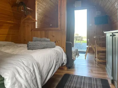 a bedroom with a bed and a desk and a window at Hardknot - Uk48484 in Dalton in Furness