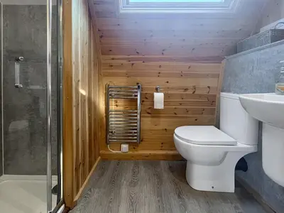 a bathroom with a toilet and a sink at Orchard - Uk48490 in Dalton in Furness