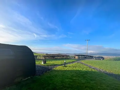 a view from the side of a building with a green field at Orchard - Uk48490 in Dalton in Furness