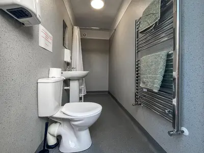 a small bathroom with a toilet and a sink at Birds - Uk48489 in Dalton in Furness