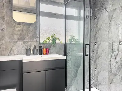 a bathroom with a sink and a shower at Stylish Preston Home 3 Beds Sleeps 6 in Preston