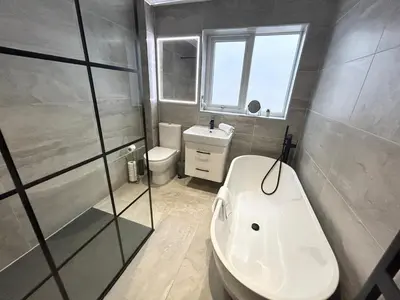 a bathroom with a sink and a toilet and a shower at Dalton House - Private Parking in Blackpool