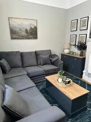 a living room with a couch and a coffee table at A Comfy Stay Close to City-Centre in Preston