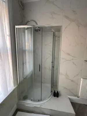a shower with a glass door in a bathroom at A Comfy Stay Close to City-Centre in Preston