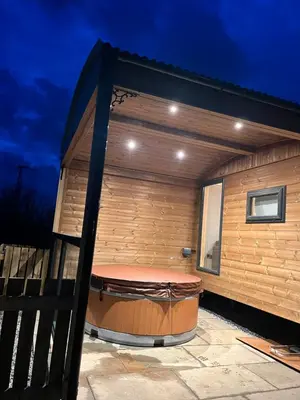 a large jacuzzi tub in a building at Mill House Farm Pods- Kingfisher in Pilling