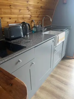 a kitchen with a sink and a counter top at Mill House Farm Pods - Mallard View in Pilling