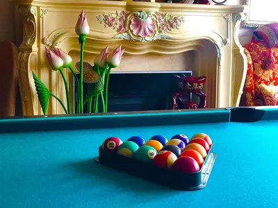 a tray of balls in a pool table at MyRoomz Tudor Rose Original in Blackpool