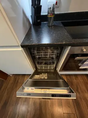 a dishwasher in a kitchen with a counter top at Stunning City View Studio Apartment by StaySavvy Accommodation in Liverpool