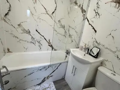 a white bathroom with a white tub and a sink at Contractors, Discounts, Free Parking, 4 BR, Sleep7 in Bidston