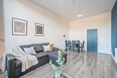 a living room with a couch and a table at Latimer Flat 1 - Spacious 2-Bed Apt - Sleeps 7 - Ground Flr in Liverpool