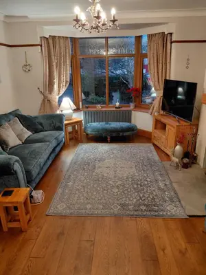 a living room with a couch and a rug at Penwortham traditional home in Penwortham
