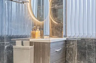 a bathroom with a sink and a mirror at Latimer Flat 2 - Spacious 2-Bed Apt - Sleeps 7 in Liverpool