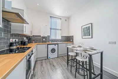 a kitchen with a counter and a dishwasher at Latimer Flat 3 - Spacious 2-Bed Apt - Sleeps 6 in Liverpool