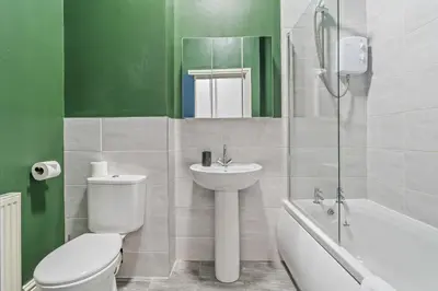 a bathroom with a toilet and a sink and a shower at Latimer Flat 3 - Spacious 2-Bed Apt - Sleeps 6 in Liverpool