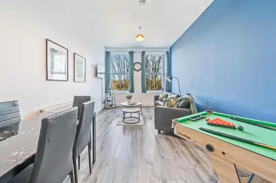 a living room with a pool table and a couch at Latimer Flat 3 - Spacious 2-Bed Apt - Sleeps 6 in Liverpool
