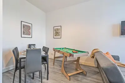 a living room with a pool table and a couch at Latimer Flat 4 - Spacious 2-Bed Apt - Sleeps 6 in Liverpool