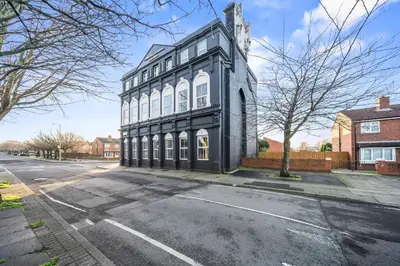a black and white building on the side of a street at Latimer Flat 5 - Spacious 2-Bed Apt - Sleeps 7 in Liverpool