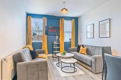 a living room with a couch and a table at Latimer Flat 5 - Spacious 2-Bed Apt - Sleeps 7 in Liverpool