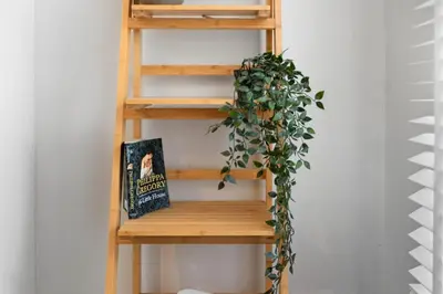 a wooden shelf with a book and a plant at Stunning 3B Home, ideal for leisure & contractors in Clitheroe