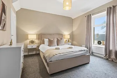 a bedroom with a large bed and a window at Stunning 3B Home, ideal for leisure & contractors in Clitheroe