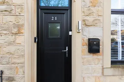 a black door with the number on it at Stunning 3B Home, ideal for leisure & contractors in Clitheroe