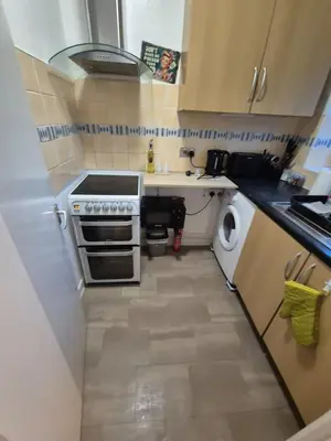 a small kitchen with a sink and a stove at COZY Apartment 4 in Liverpool