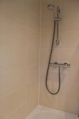 a shower with a shower head in a bathroom at Whole House in Liverpool, Merseyside in Liverpool