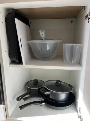 a kitchen stove with two pans and a bowl at Liverpool Central City Centre Modern Apartment - Sleeps 4 in Liverpool