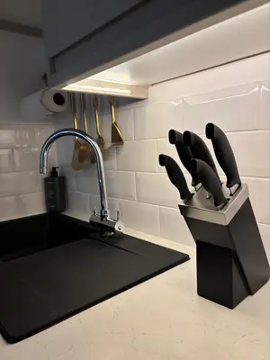 a kitchen sink with knives in a knife block at Liverpool Central City Centre Modern Apartment - Sleeps 4 in Liverpool