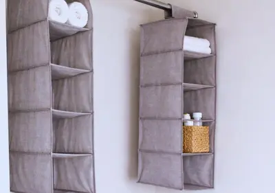 a bathroom mirror hanging on a wall with towels at The Red Lounge House Near Anfield sleeps 14 LFC in Liverpool