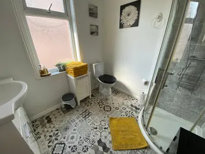 a bathroom with a shower and a toilet at Mayfield House-Private Hosted Stay with Breakfast in Blackpool