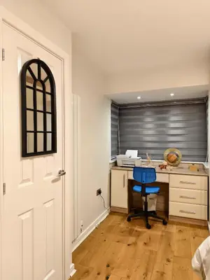 an office with a desk and a blue chair at Hanani House in Liverpool