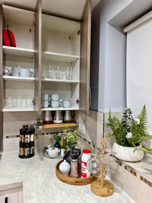 a kitchen with a counter with plants on it at Hanani House in Liverpool
