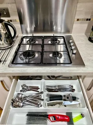 a stove top oven sitting inside of a kitchen at Hanani House in Liverpool