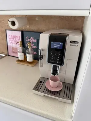 a coffee maker with a cup on a shelf at Luxurious Ribble Valley Home in Clitheroe