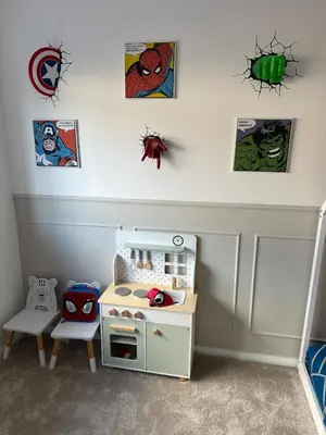 a childs room with a play set and pictures on the wall at Luxurious Ribble Valley Home in Clitheroe
