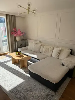 a living room with a couch and a table at Luxurious Ribble Valley Home in Clitheroe