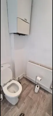 a bathroom with a white toilet in a room at The Victorian Terrace in Morecambe