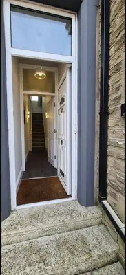 an open door of a house with a hallway at The Victorian Terrace in Morecambe
