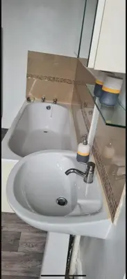 a bathroom sink with a box on top of it at The Victorian Terrace in Morecambe