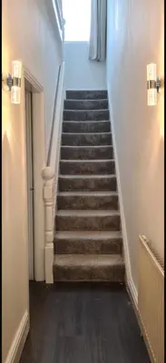 a staircase in a building with a stair case at The Victorian Terrace in Morecambe